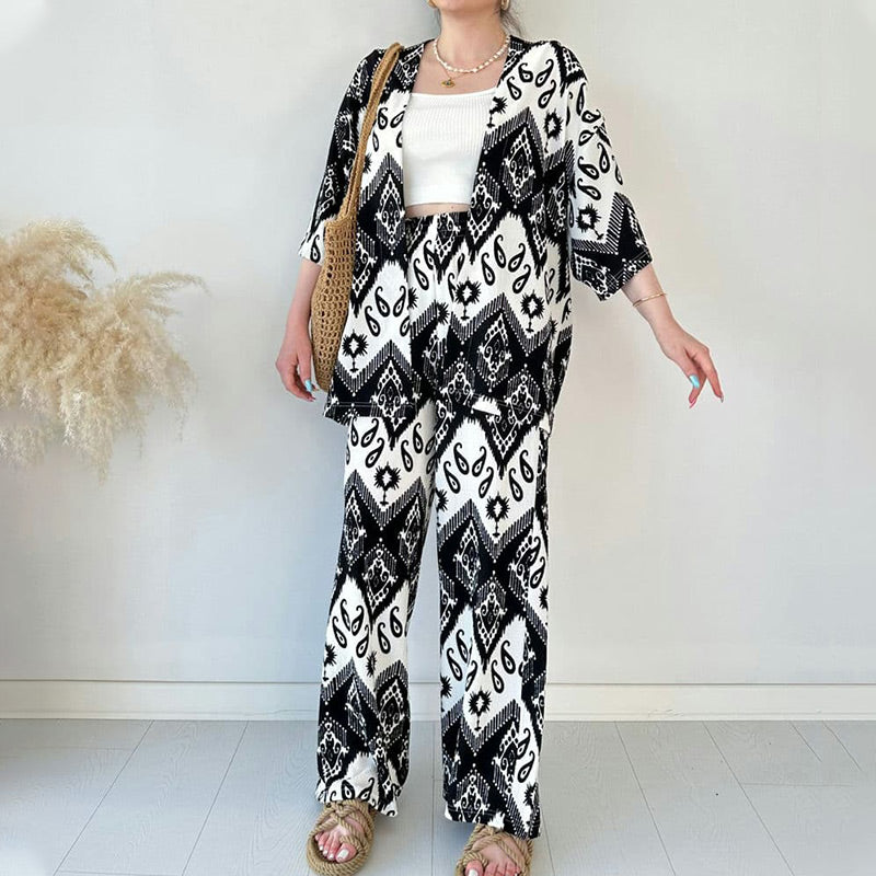 kostenloser Versand！！！🌸Zweiteiliges Set aus bedruckter Strickjacke mit halblangen Ärmeln und trendiger Hose mit weitem Bein